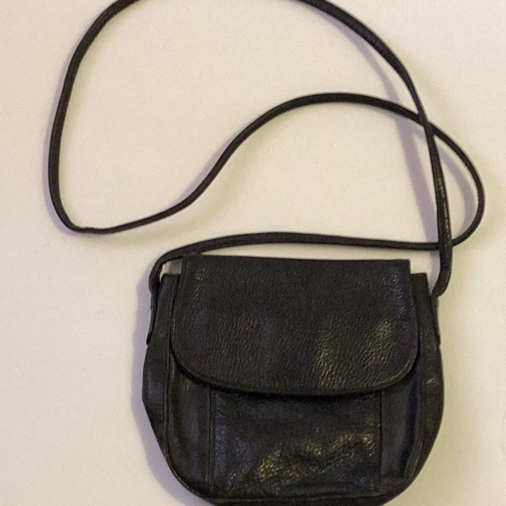 Compact Black Crossbody Bag with Leather Material and Flap Closure
